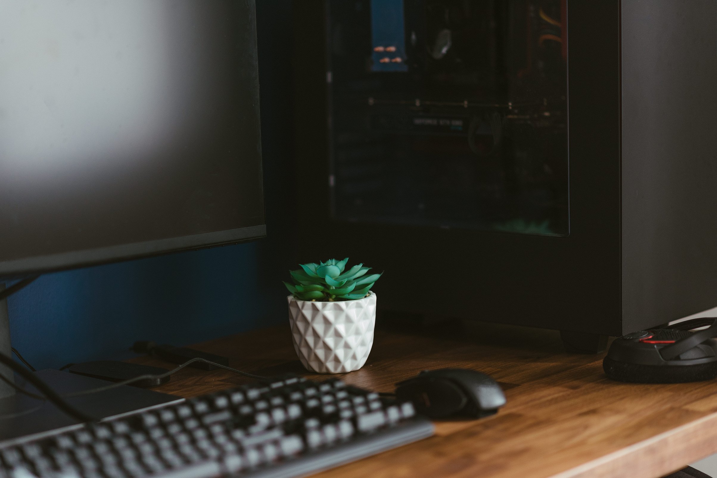 White Ceramic Vase Near Black Computer Keyboard